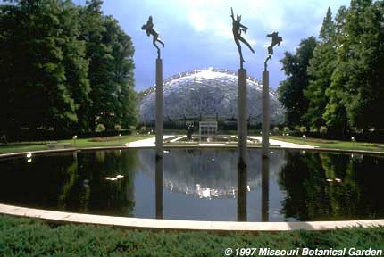 Far shot of 'Angel Musicians ' againtst the Climatron 