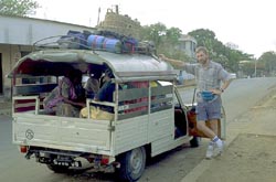 Larry beside taxi-brousse