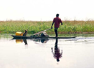 Man and canoe on river